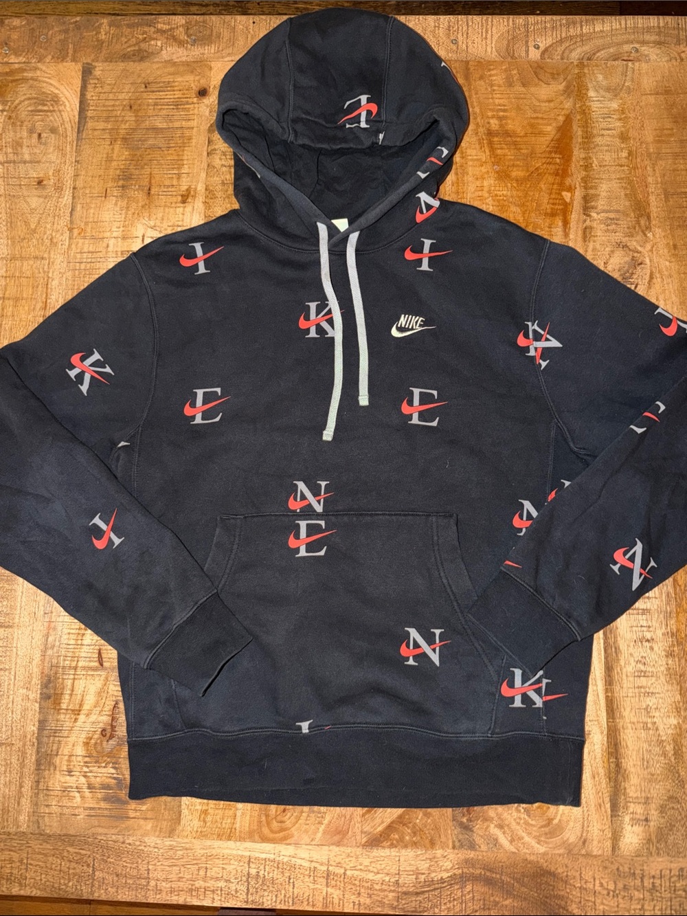 Nike Black Hoodie with Red and White Logo Pattern